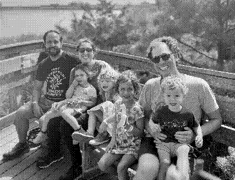 A sunny family outing on a riverside boardwalk.