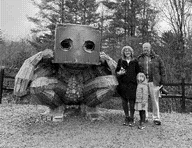 Standing with a giant wooden troll—whimsical roadside art and a family moment.
