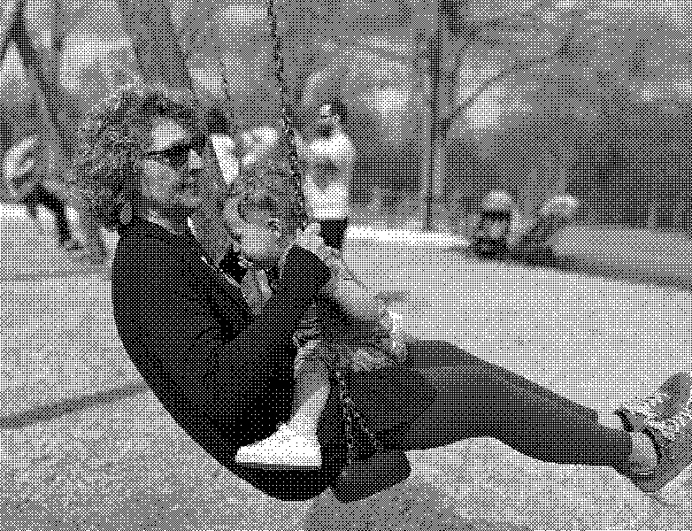 A child clings to their grandmother on a swing at the playground.